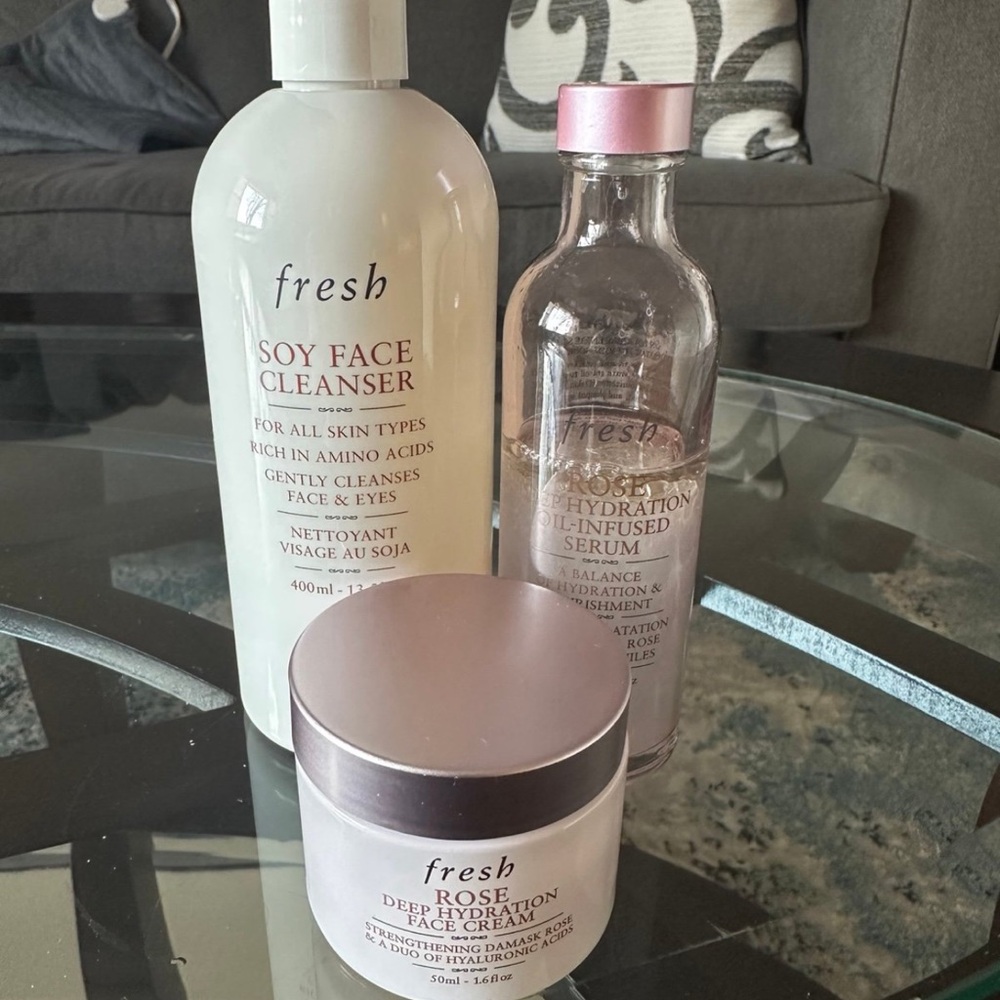 Fresh Skincare Trio: White Cleanser, Pink Serum, and Cream Moisturizer